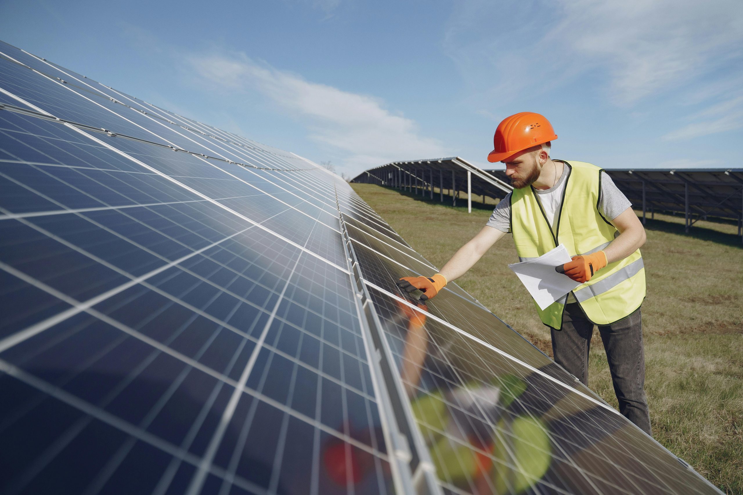 Tri-Vision engineer inspecting a solar panel installation
