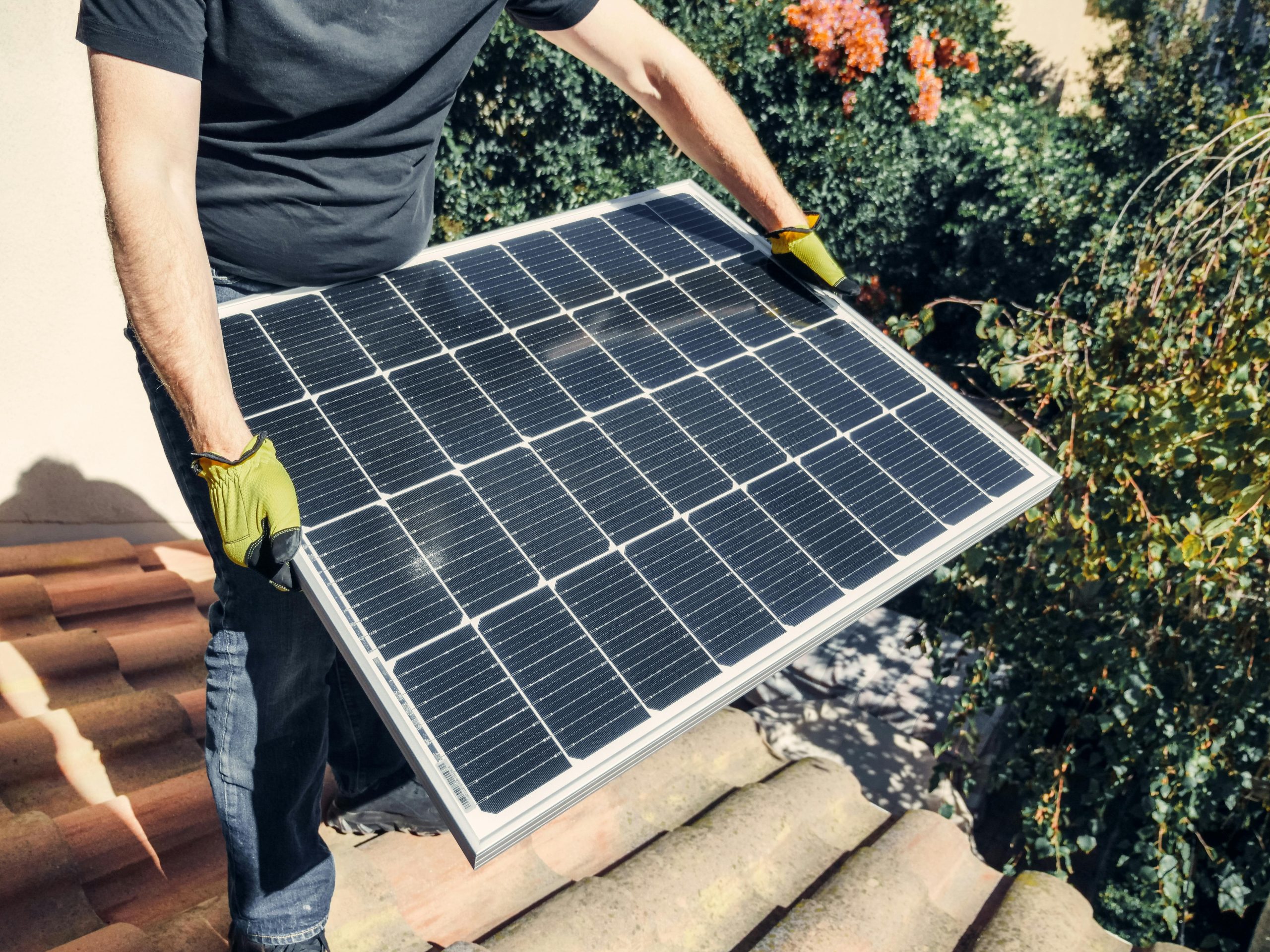 Engineer inspecting a rooftop solar array